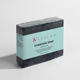 Ivalro Charcoal Soap: wrapped bar and loose bar at an angle