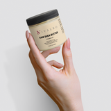 Ivalro Raw Shea Butter: hand holding the jar seen from above