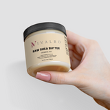 Ivalro Raw Shea Butter: hand holding the jar up