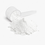 Nitric Shock Pre-Entreno (Ponche de Frutas) de Ivalro: primer plano del cacito con el polvo